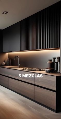 a modern kitchen with black cabinets and wood flooring is featured in this image from the magazine 5 mezclas