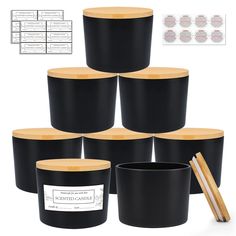 six black containers with wooden lids and chopsticks in front of each container,