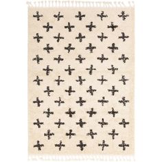 a black and white rug with crosses on the front, in various sizes and colors