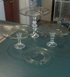 three clear glass dishes sitting on top of a counter