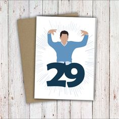 a greeting card with the number twenty nine, featuring a man in blue shirt and jeans