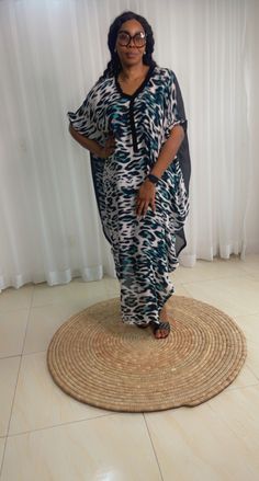 This Adire Ankara Silk Kaftan maxi dress is made with Polysilk. It can be styled in different ways, you can dress it up with high heels or dress down with flats/sneakers. The Hand can be worn in 2 ways. one ways shows off the arm, the 2nd way has the arm covered for modesty. Notice the slits.Other prints are also available, kindly start a conversation to ask for more information and pics.Contact us for custom looks and more style options. Sizing 🌺 Your height or desired kaftan length is needed. Casual Chiffon Maxi Dress Beach Cover-up, Bohemian Short Sleeve Maxi Dress For Evening, Flowy Chiffon Maxi Dress For Beach Cover-up, Flowy Chiffon Maxi Dress For Beach, Chic Chiffon Maxi Dress For Day Out, Casual Chiffon Floor-length Maxi Dress, Spring Flowy Chiffon Kaftan, Casual Chiffon Maxi Dress For Beach, Flowy Casual Chiffon Maxi Dress