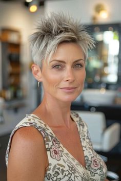 Woman with short, spiky gray hair in a salon, wearing a floral-patterned top. Short Spiky Haircuts, Rock Chic, Short Hair Cuts, Short Hair, Short Hair Styles, Hair Cuts, Hair