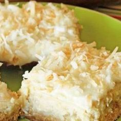 a piece of coconut cream pie on a green plate