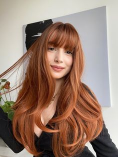 A copper-colored, long, and straight synthetic wig with bangs features strands in a rich, warm copper hue, adding a touch of vibrancy and uniqueness to the overall appearance. The wig boasts a sleek and straight texture, providing a polished and sophisticated look. The length extends generously, falling below the shoulders for a glamorous and flowing effect. The inclusion of bangs adds a fashionable element, and they can be styled straight-across, enhancing the wig's versatility. The synthetic f True Copper Hair, Ginger Hair For Cool Skin Tones, Cute Unique Hairstyles For Long Hair, What To Wear With Copper Hair Outfit, Red Long Hair With Bangs, Cool Tone Copper Hair, Full Bangstyle Hair Medium, Copper Hair Bangs, Ginger Straight Hair