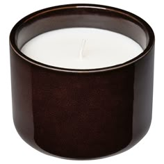 a close up of a candle on a white background with a brown rim around it