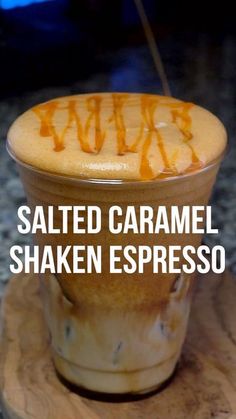 salted caramel shaken espresso in a cup with the words salted caramel on top