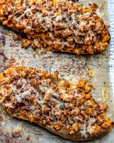 two stuffed sweet potatoes on a baking sheet