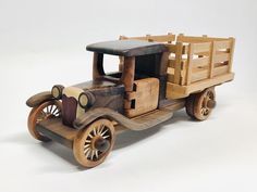 an old fashioned wooden toy truck on a white background