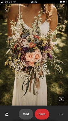 a woman holding a bouquet of flowers in her hands