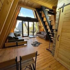 an open loft with wooden floors and stairs