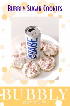 a can of soda and some cookies on a plate