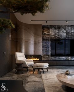 a living room with a large fireplace and two chairs in front of the fire place