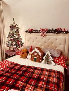 a bedroom decorated for christmas with gingerbreads and cookies on the bed