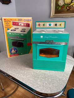 two ovens sitting on top of a table next to each other