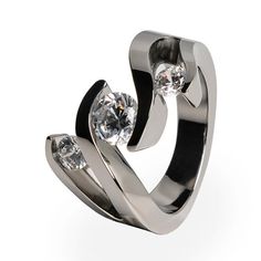 Ladies Titanium Ring with diamonds. This one-of-a-kind creation features a triple tension setting that makes your Diamonds or gemstones appear to float in a flowing wave. Solitary Engagement Ring, Titanium Engagement Ring, Contemporary Diamond Ring, Titanium Engagement Rings, Floating Ring, Black Titanium Ring, Engagement Ring Women, Contemporary Engagement Rings, Diamond Rings Design