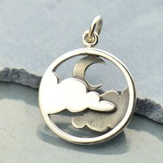 Sterling Silver Moon and Cloud Pendant. Always looking for the silver lining? Then look no further than this beautiful, silvery night sky pendant. Conjuring images of romantic walks by moonlight when the air is crisp with a light winter breeze, this piece is perfect on it's own, just dangling from a silver chain or simple silk cord. Your sterling silver moon and cloud pendant measures (mm) Length: 21 Width: 15 Height: 1.5. Length includes 5 mm jump ring. The purchase of this listing includes one Jewelry Rings Unique, Cloud Pendant, Silver Cloud, Moon Jewelry, Silver Jewelry Rings, Silver Lining, Silver Moon, I Love Jewelry, Moon Pendant