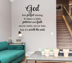 a living room with a green couch and wall decal that says god has perfect thing it takes a little practice and faith never late, but it's worth the wait