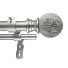 a close up of a metal curtain rod with marbled knobs on the top