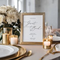 a table with candles, plates and flowers on it