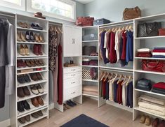 a walk in closet filled with lots of clothes and shoes on top of white shelves