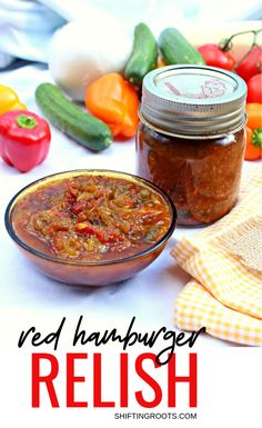 red hamburger relish in a glass bowl next to some vegetables and peppers on the table