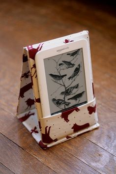 an electronic device sitting on top of a wooden table