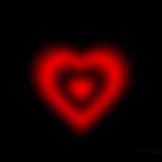 a red heart on a black background