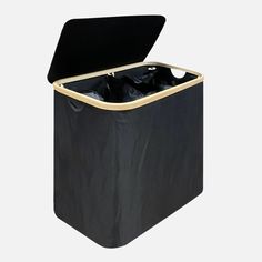 an open black trash can with gold trim