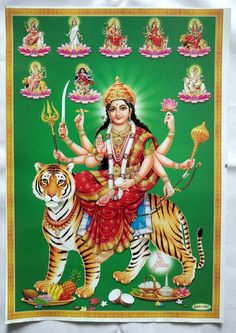 the hindu goddess sitting on top of a tiger