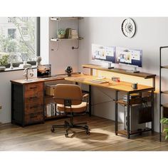 an office with a desk, chair and computer monitor on the wall next to it