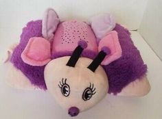 a purple and white stuffed animal with ears