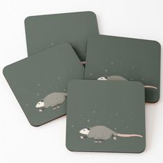 four coasters with an image of a rat on them and stars in the sky