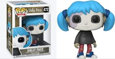 a pop vinyl figure with blue hair and black shirt, in front of a white box