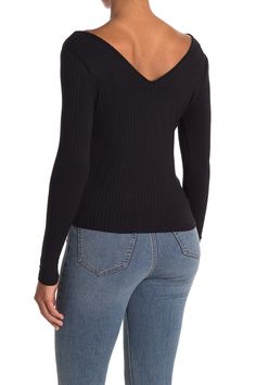 A wide neck and front tie detail adds a flirty touch to a long sleeve top.Fit: this style fits true to size. XS=000-00, S=0-2, M=4-6, L=8-10. Wide v-neck. Long sleeves. Slips on over head. Front tie detail. Solid. Knit construction. Approx. 20" length. Imported Fire Love, Love Fire, Long Sleeve Top, Nordstrom Rack, Open Shoulder Tops, Long Sleeve Tops, Sleeve Top, Slip On, Long Sleeves