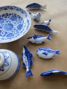 blue and white porcelain fish next to a bowl