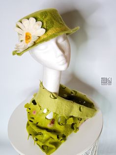 This fresh green boater hat is hand felted from soft merino wool with lot of added silk for beautiful texture and pattern. It is decorated with cheerful daisy. Size approx 57 cm. All my felt hats for women are handcrafted, unique and ooak.  Care instructions: Very easy. The wool naturally repels dirt so it will stay clean for a long time. If you feel it is necessary, hand wash in lukewarm water using shampoo or gentle wool detergent, shape on a balloon on a towel and let dry. Made in smoke free Canotier Hat, Cheerful Daisy, Felted Hat, Hat Flower, Felt Hats, Flower Hat, Floral Hat, Boater Hat, Flower Hats