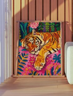 a painting of a tiger laying on top of a pink flowered blanket in front of a wooden slatted wall