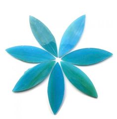 a blue flower shaped object on a white surface