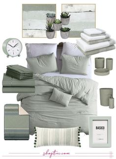 a bedroom with grey and white bedding, green plants and pictures on the wall