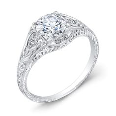 a white gold engagement ring with an intricate design