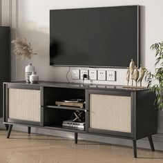 an entertainment center with a flat screen tv mounted on it's side, in a living room