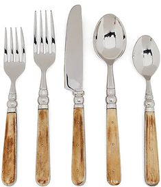 an assortment of silverware including forks, knives and spoons with wood handles on white background