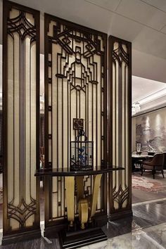 an art deco room divider in the middle of a lobby