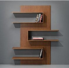 the bookshelf is made out of wood and has three shelves on each side