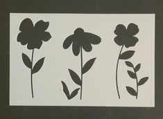 three flower stencils are shown on a black and white background, each with different flowers