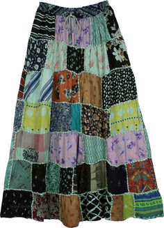 A cheerful ankle-length skirt with mixed patchwork, this rayon fabric skirt has a chic bohemian style.  It features square dori that gives it a unique artisanal look. #tlb #Patchwork #MaxiSkirt #Printed #bohemianfashion #longrayonskirt #patchworkskirt #squaredoriskirt Green Bohemian Patchwork Maxi Skirt, Bohemian Green Patchwork Maxi Skirt, Multicolor Patchwork Maxi Skirt For Festivals, Hippie Multicolor Patchwork Maxi Skirt, Hippie Patchwork Multicolor Maxi Skirt, Hippie Multicolor Maxi Skirt With Patchwork, Hippie Cotton Patchwork Maxi Skirt, Patchwork Maxi Skirt, Skirt Patchwork