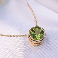 1.20 Carat Natural Peridot 14k Solid Gold Necklace Necklace Material: 14k Solid Gold  Total Metal Weight: 1.8 Grams  Gemstone: Natural Peridot Gemstone Color: Green Gemstone Shape: Round Gemstone Dimensions: 6.50x6.50mm Gemstone Quantity: 1 Gemstone Total Carat Weight: 1.20 Carat Pendant Face Measures: 8.00x8.00 mm Chain Length: 16 inch Necklace Quantity: One Pendant with a Chain Necklace Condition: New  Made in the USA Delivered in an elegant gift box 💜 JulLuxJewelry is here for You, so please Luxury Yellow Gold Gemstone Birthstone Necklace, Jewelry Redesign, Gold Necklace Pendant, Silver Gold Jewelry, 16 Inch Necklace, Peridot Jewelry, Peridot Necklace, Gold Chain With Pendant, Peridot Green