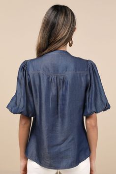 Bring a chic vibe to your everyday looks with the Lulus Contemporary Crush Dark Blue Chambray Puff Sleeve Button-Up Top! Lightweight woven chambray fabric shapes this stylish top that has pleated-like detailing at the shoulders and short puff sleeves with elastic at the cuffs. Crew neckline tops a functional, hidden button placket that runs down the bodice to rounded hems. Fit: This garment fits true to size. Length: Size medium measures 25" from shoulder to hem. Bust: Great for any cup size. Wa Denim Blue Button-up Workwear Blouse, Chic Denim Button-up Top, Chic Short Sleeve Denim Top For Day Out, Casual Button-up Puff Sleeve Top With Button Closure, Casual Button-up Puff Sleeve Top, Casual Puff Sleeve Button-up Top, Chic Short Sleeve Denim Blue Top, Chic Denim Blue Short Sleeve Top, Fitted Denim Top With Puff Sleeves