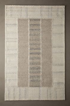 an area rug with different colored stripes on it